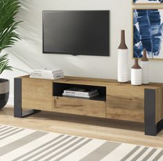 a white and black entertainment center in a living room