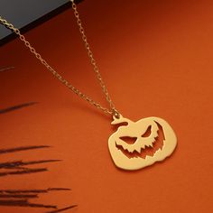 Elevate your Halloween style with our exquisite 14K Solid Gold Halloween Jack-o-Lantern Necklace. This dainty pumpkin pendant adds a touch of whimsy and charm to your spooky season. Whether it's a Trick or Treat gift for children or a cute pumpkin necklace for yourself, this piece is a timeless celebration of Halloween. 🎃 Key Features: Crafted from genuine 14K solid gold for enduring beauty. A delightful Jack-o-Lantern charm that captures the essence of Halloween. Dainty and versatile, perfect Lantern Necklace, Gold Halloween, Pumpkin Necklace, Halloween Style, Halloween Cute, Halloween Jack O Lanterns, Treat Gift, Halloween Jack, Pumpkin Pattern