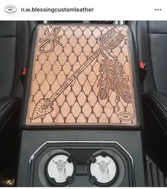 the inside of a car with an intricate design on it's center console area