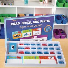 an open box with sight word center cards in it on a table next to some bookshelves