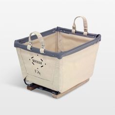 a white and blue shopping basket with handles