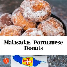 powdered sugar donuts in a black bowl with a sign that says, masadas portuguese donuts