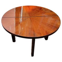 an oval wooden table with two legs and a circular top, on a white background