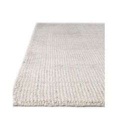 a white rug is shown on a white background and it looks like the carpet has been made