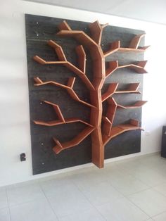 a wooden tree is mounted to the wall