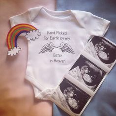 a baby's bodysuit with the words hand picked for earth by my sister in heaven