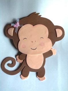 a paper cut out of a monkey with a bow on it's head and eyes