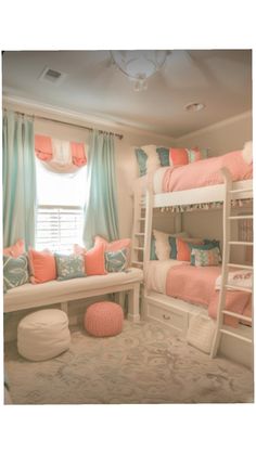 a bedroom with bunk beds and pillows on top of them in front of a window