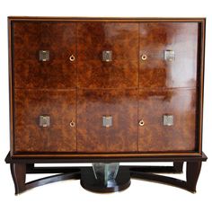 a wooden cabinet with metal handles and knobs