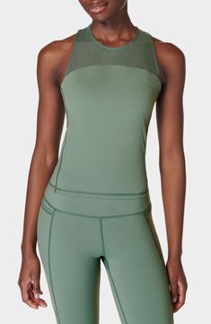 A built-in sports bra provides added support to this sweat-wicking mesh-yoke tank designed with cross-back straps and quick-drying abilities. 19" length (size Medium) Jewel neck Fixed straps Built-in bra Moisture-wicking fabric engineered for dryness and comfort 62% polyamide, 38% elastane Machine wash, dry flat Imported Compression Running Activewear With Mesh Back, High Stretch Activewear For Running With Mesh Back, Functional Nylon Racerback Activewear, Athleisure Activewear With Mesh Racerback, Mesh Compression Activewear For Athleisure, Compression Activewear With Mesh Back For Sports, Compressive Activewear With Mesh Back For Training, Fitted Activewear With Mesh Back For Running, Fitted Activewear For Running With Mesh Back