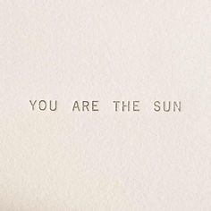 the words you are the sun written on a piece of white paper with brown ink