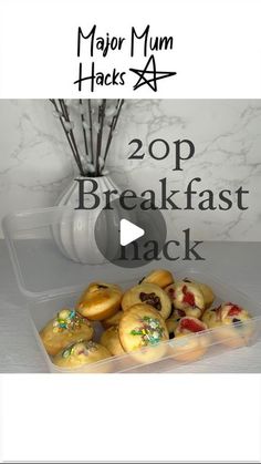 a plastic container filled with pastries on top of a table