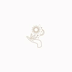 a hand holding a flower with a sun in the middle and stars coming out of it