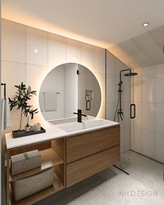 a bathroom with a sink, mirror and shower stall in it's center area