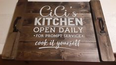 a wooden sign that says clis's kitchen open daily for prompt service cook it yourself