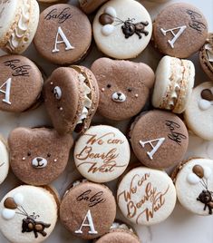 some cookies are decorated with teddy bears and letters