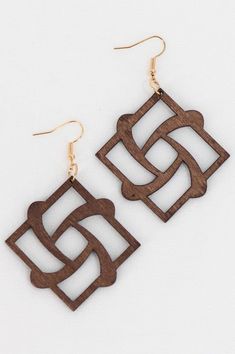 the wooden earrings are designed with geometric shapes