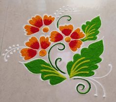 an artistic design on the ground with leaves and flowers painted on it for diwaling