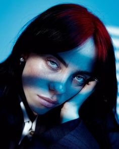 a woman with red hair and blue eyes