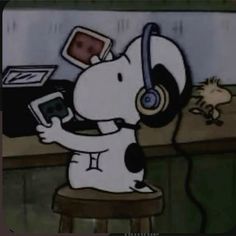 a cartoon dog with headphones on sitting at a bar and holding a cell phone