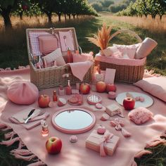 a picnic table with pink and white items on it in an apple orchard, surrounded by wicker baskets