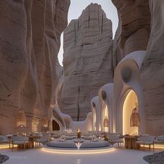 the interior of a restaurant in an area that looks like it is surrounded by rocks