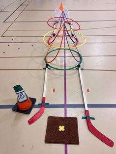 a christmas tree made out of skis and other items on a floor with lines