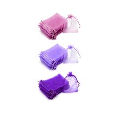 three small bags with purple and pink organes in them on a white surface, one is