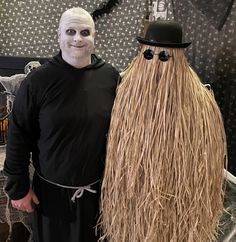 two people in costumes standing next to each other