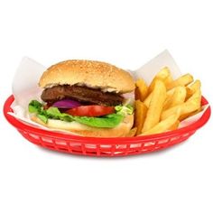 a hamburger and fries in a red basket on a white background with clippings