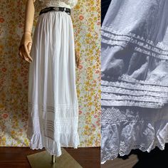 Antique skirt with adorable details: stitched stripes and eyelet ruffle. All cotton. Gathered on the waist, maxi length. The closure on the waist belt is missing. The waist size is tiny, but it's possible to attach laces and wear it with open closure (like shown on mannequin). DETAILS: Brand: no label Composition: no label, 100% Cotton Lining: none Size: no label, the waist is tiny (see measurements, dress form is US 4) Very good vintage condition MEASUREMENTS: Waist: 22.25''/56.5 cm Hips: free Daywear Ruffled Petticoat, Cotton Bottoms With Ruffle Hem For Daywear, Cotton Skirt With Ruffle Hem For Daywear, Waist-length Bottoms For Summer Daywear, Summer Cotton Skirt With Attached Cancan, Vintage Long Ruffled Petticoat, Vintage Long Gathered Skirt Bottoms, Daywear Tiered Skirt Petticoat With Ruffles, Daywear Ruffled Tiered Skirt Petticoat