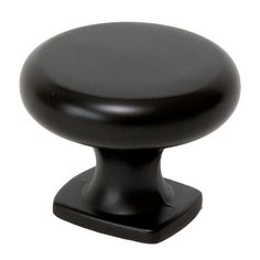 a black cabinet knob on a white background