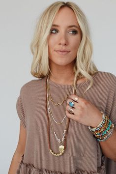 This stunning whimsical piece captures the essence of everything boho, the Hidden Treasures Necklace is a must - have to accessorize all your outfits! From tee's to maxi dresses you'l love wearing this free - spirited piece because it features: 4 layers that include chains, rope, and a beaded strand Multi - size chains Multi - color and multi - size beads throughout Cute metal pendant as the eye - catching center - piece *Due to lighting and differences in monitors, actual colors may vary slightly from what appears online. Model is 5'8" and wearing a size OS. Approximate measurements are as follows: ONE SIZE: Length: 20" Leather, Iron, natural stone, glass, zinc Hand wash cold, Lay flat to dry Import | Women's Hidden Treasures Necklace Boho Essentials, Bralette Outfit, Free Spirited, Hidden Treasures, Metal Pendant, New Tops, Sock Shoes, Hair Jewelry, Maxi Dresses