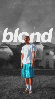 a man standing in front of a house with the word blond on it