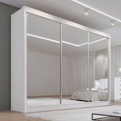 a white bedroom with mirrored closet doors and lights on the ceiling is pictured in this image