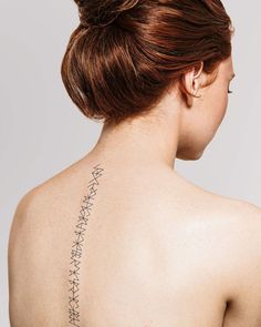 a woman with a tattoo on her back