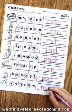 a hand holding a pen over a printable worksheet with words and pictures on it