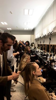 a group of people getting their hair done