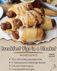 the breakfast pigs in a blanket recipe is shown on a table with other food items