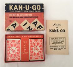 an old game called kan - u - go and two other games are laying next to each other