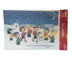 a christmas card with peanuts and friends singing in front of a church on a snowy day