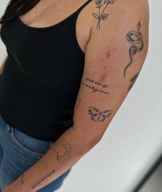 a woman with a tattoo on her arm