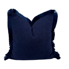 a blue pillow with fringes on it