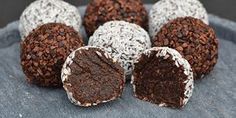 chocolate truffles on a blue plate with white and brown sprinkles