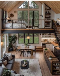 a living room filled with furniture and lots of windows