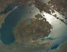 an aerial view of the water and land in this image is taken from space, looking down on it