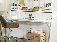 a white desk with some books on top of it and a chair next to it