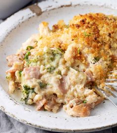 a close up of a plate of food with broccoli and chicken casserole