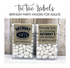 two clear plastic containers filled with white chocolate covered marshmallows and the words, birthday party favors for adults