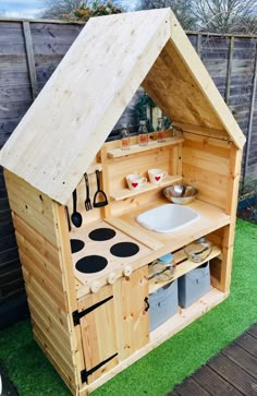 an outdoor kitchen made out of pallet wood